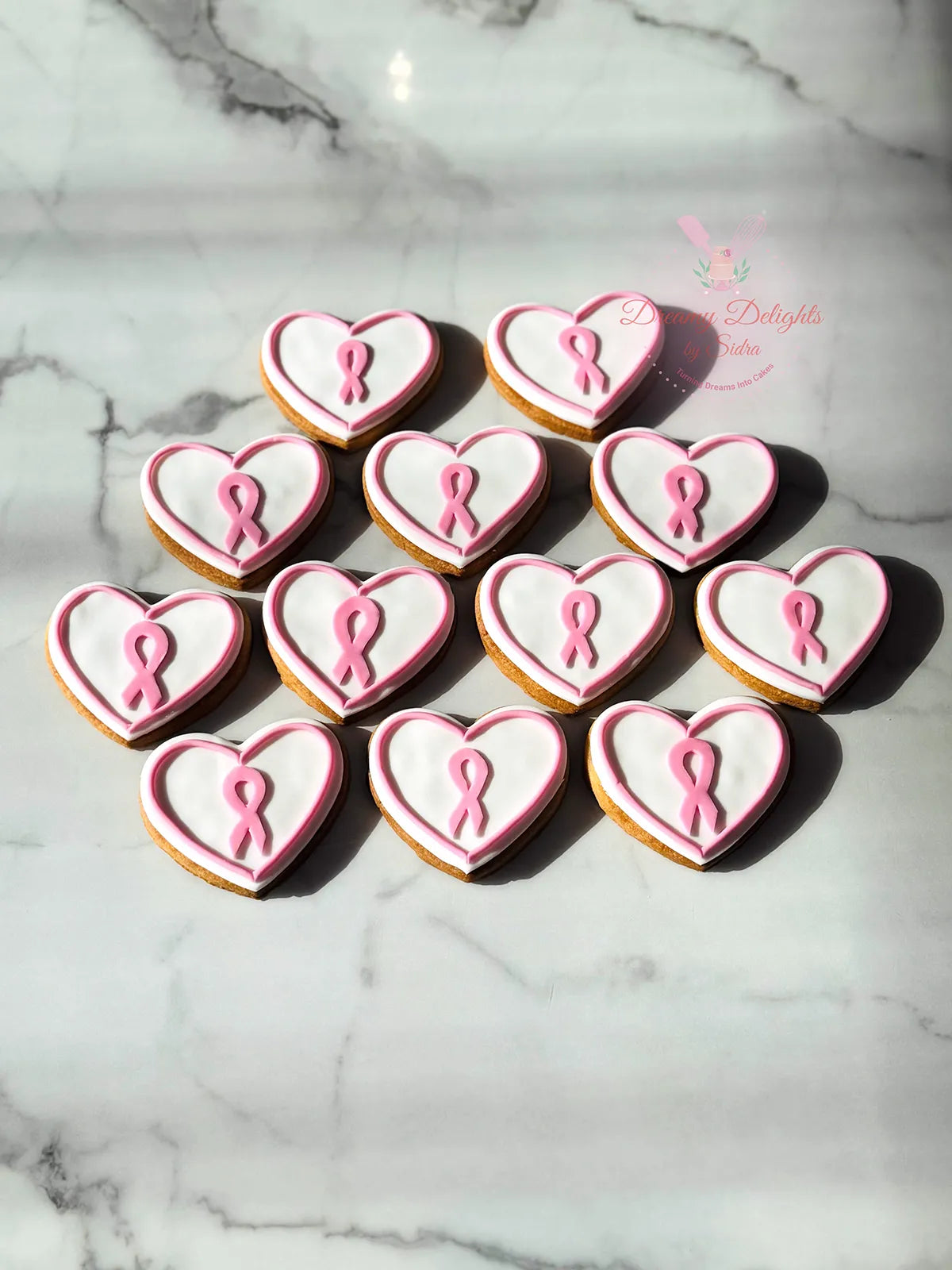 Pink Ribbon Breast Cancer Cookies Dubai made for awareness events by Dreamy Delights by Sidra
