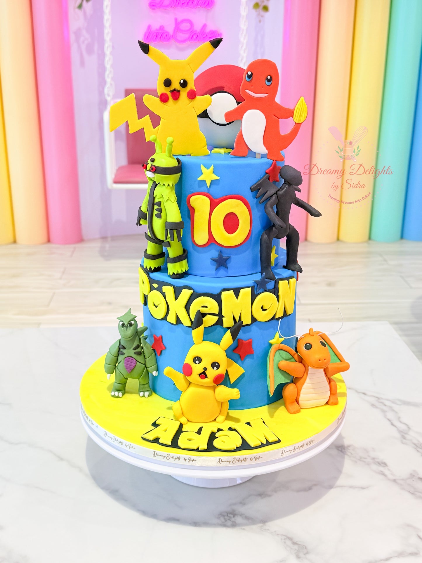 Pokemon themed cake for boy birthday Dubai  custom character cake by Dreamy Delights by Sidra