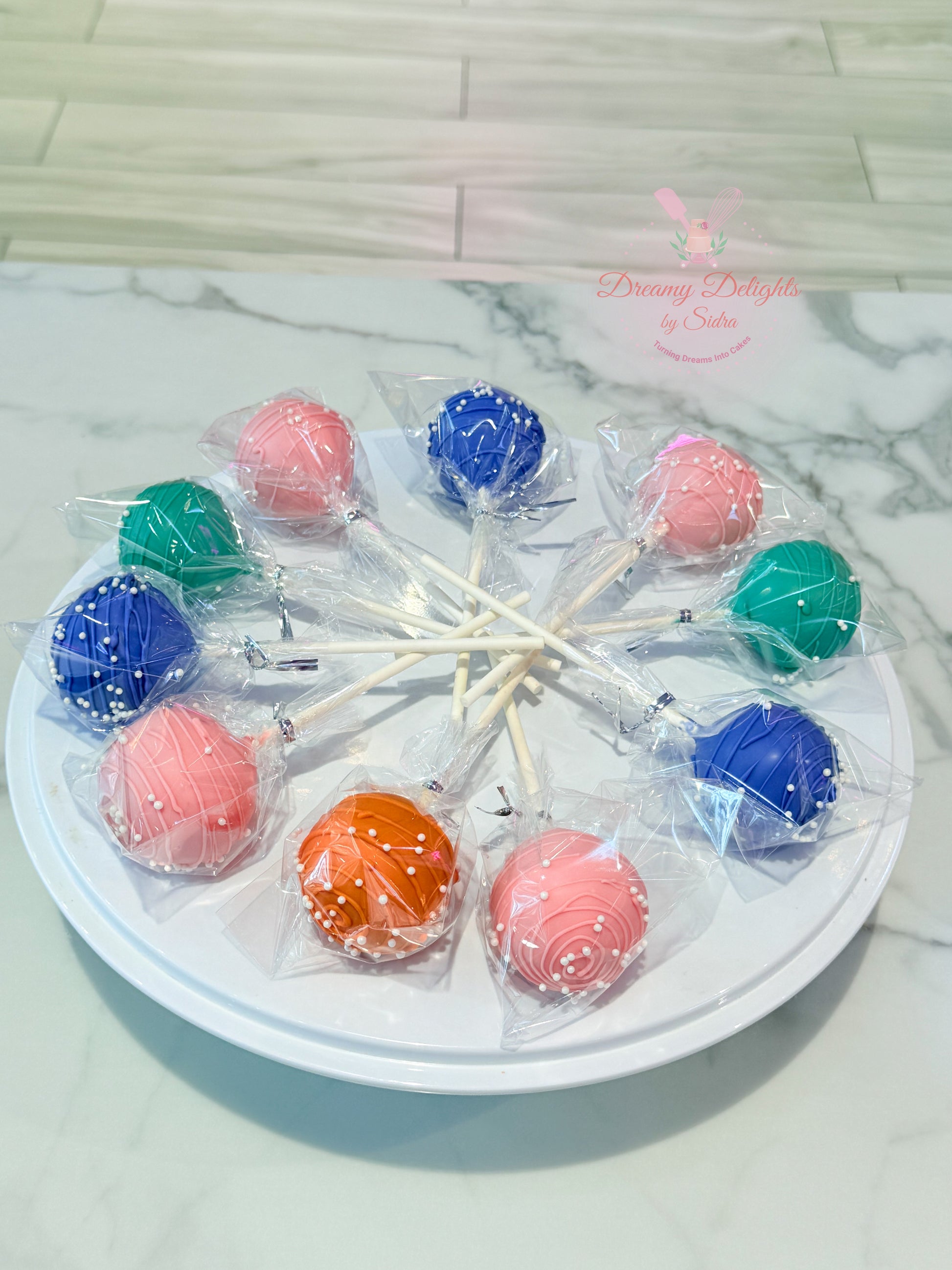 Colorful chocolate cakepops individually wrapped for party dessert table in Dubai