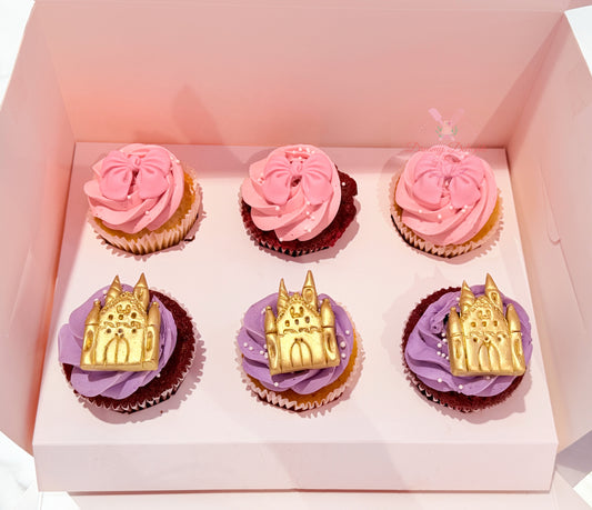 Princess themed cupcakes with pink bows, golden castle toppers, and lavender buttercream frosting for birthday parties in Dubai.
