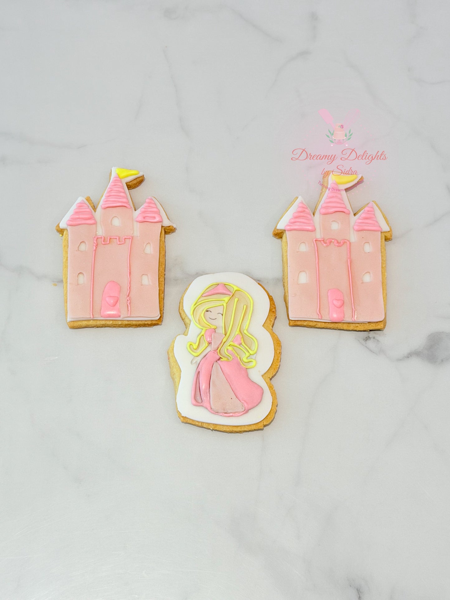 Princess castle cookies with pink icing and character design for girls party favors in Dubai