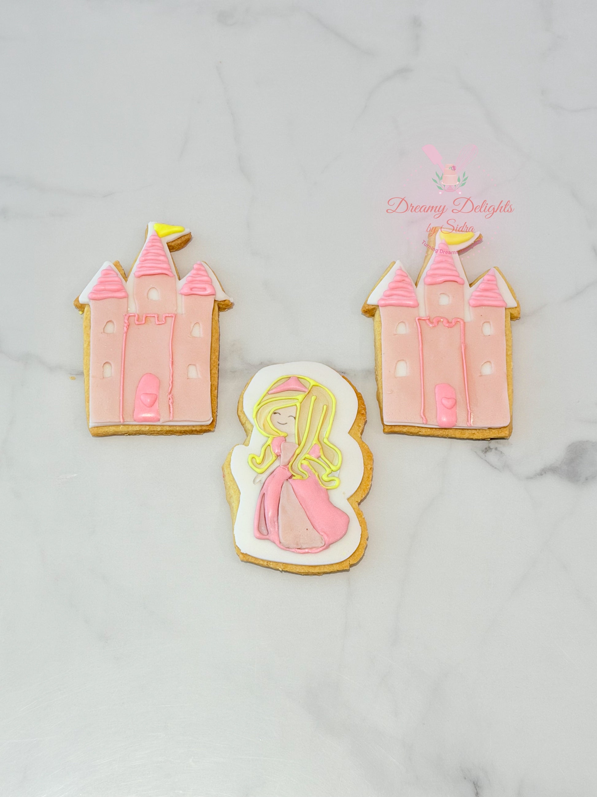 Princess castle cookies with pink icing and character design for girls party favors in Dubai