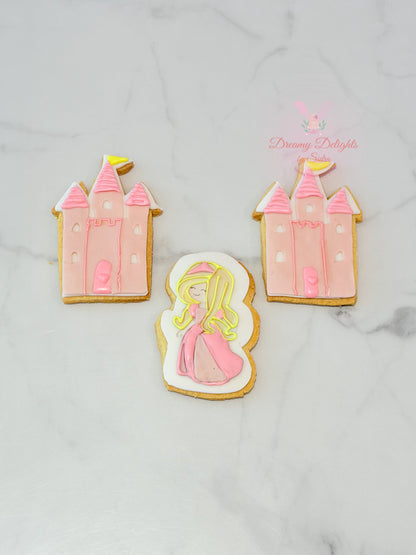 Princess castle cookies with pink icing and character design for girls party favors in Dubai