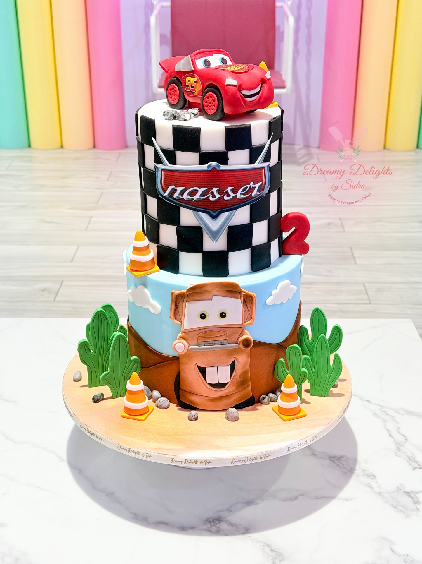 Cars Movie birthday cake with Lightning McQueen, Mater, racing flag design and Disney Pixar theme for boys in Dubai