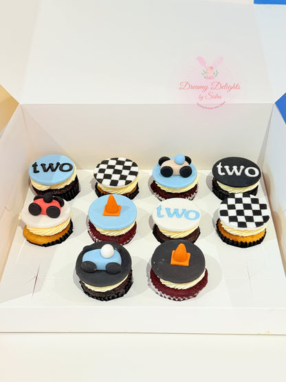 Racing car theme birthday cupcakes with fondant cars and checkered flag toppers for kids party in Dubai