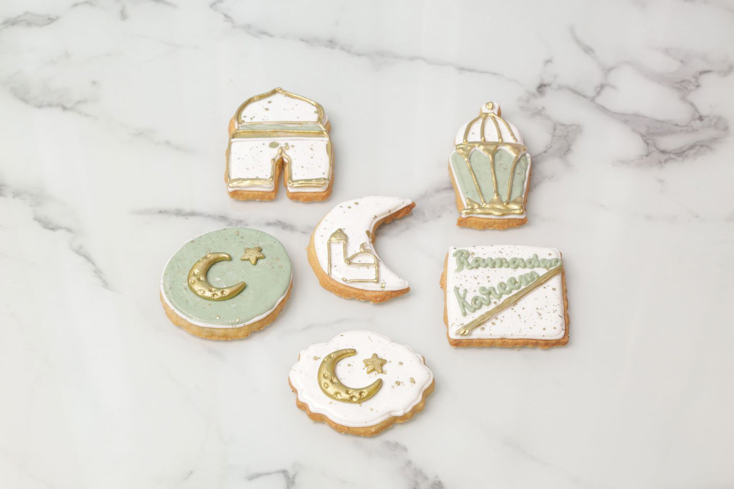 Ramadan Kareem green and white cookies with crescent moon lantern and mosque designs custom Ramadan cookies Dubai