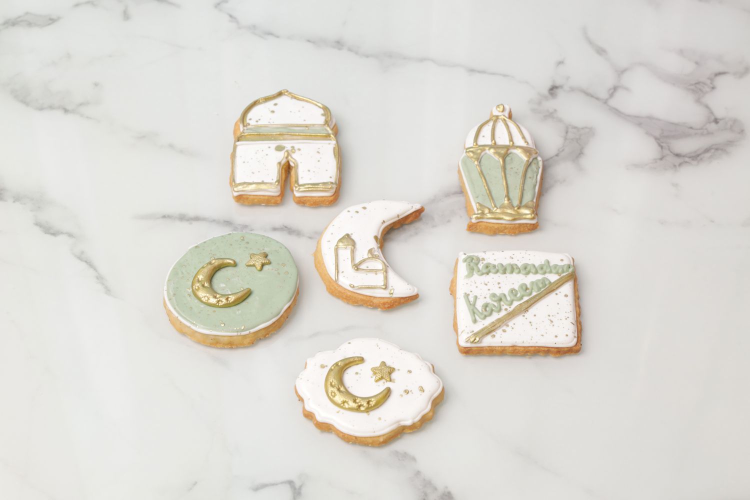 Ramadan Kareem green and white cookies with crescent moon lantern and mosque designs custom Ramadan cookies Dubai