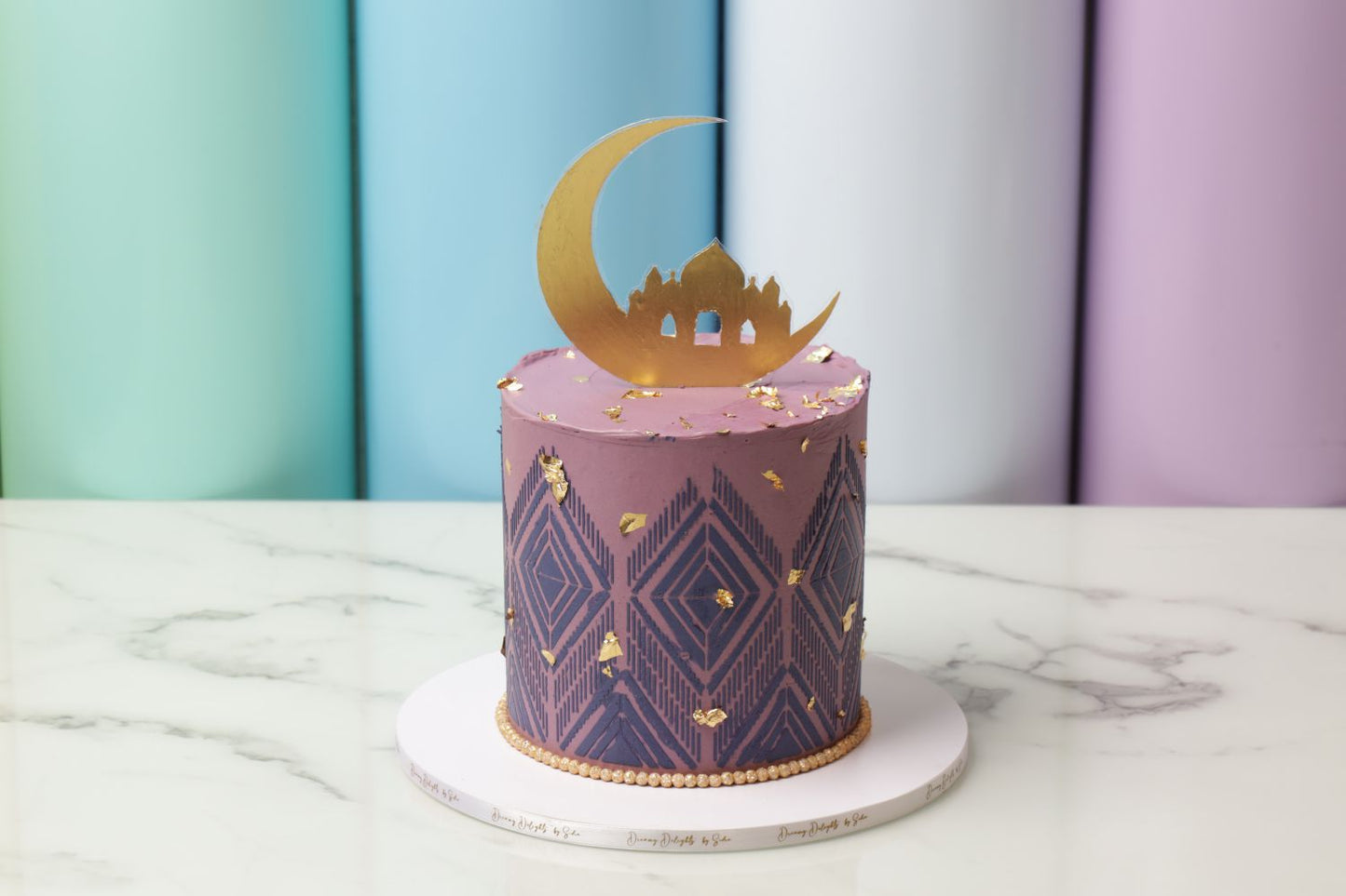 Ramadan cake with lilac geometric texture, edible gold flakes and crescent moon topper luxury Ramadan cake Dubai