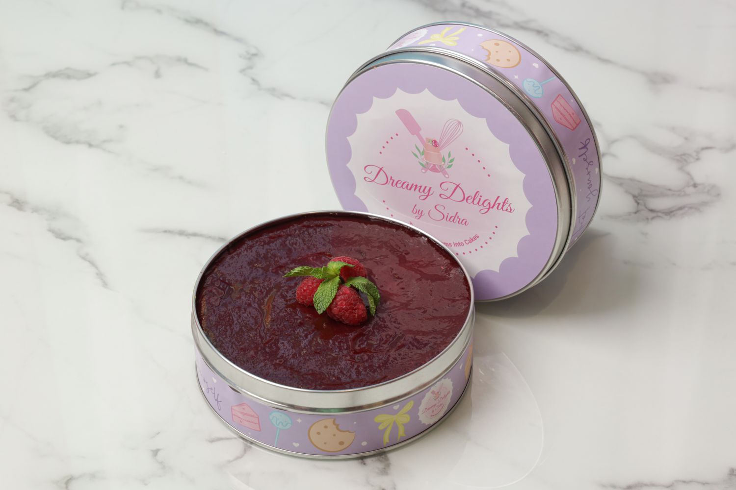 Raspberry chocolate kunafa dream cake tin layered with chocolate cake creamy cheese pistachio kunafa white chocolate and raspberry sauce Dubai