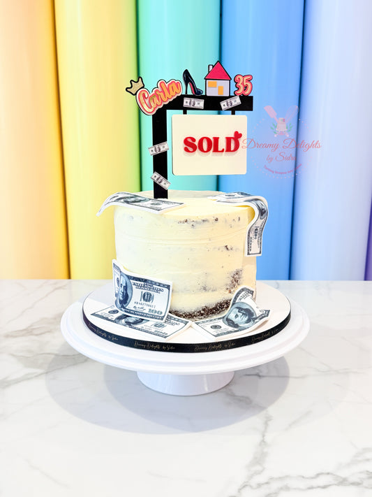 Real estate sold cake with personalised SOLD topper, money decorations and cream frosting, a unique birthday cake for her in Dubai by Dreamy Delights by Sidra.