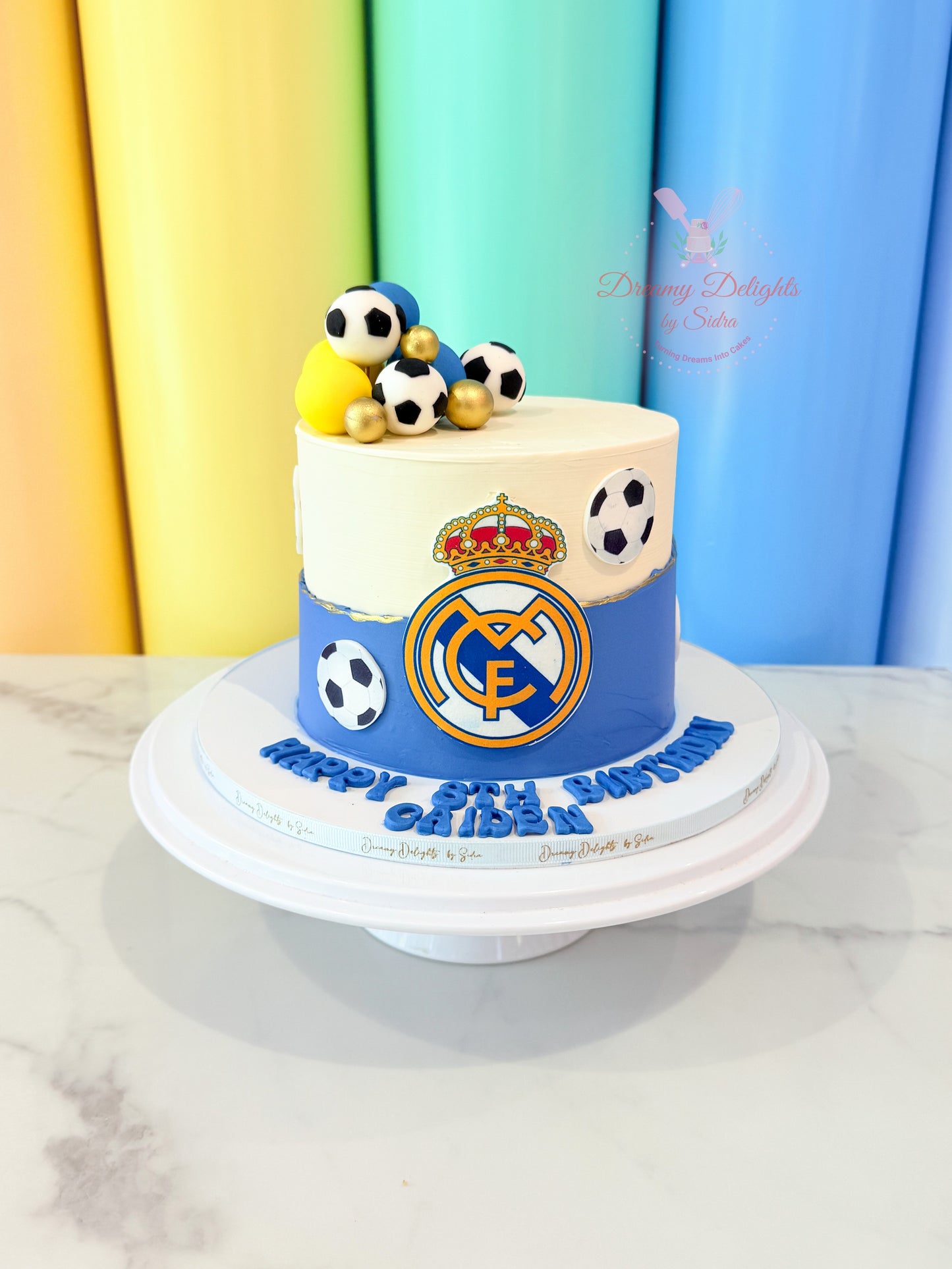 Real Madrid football theme birthday cake with soccer ball decorations for boys birthday party in Dubai