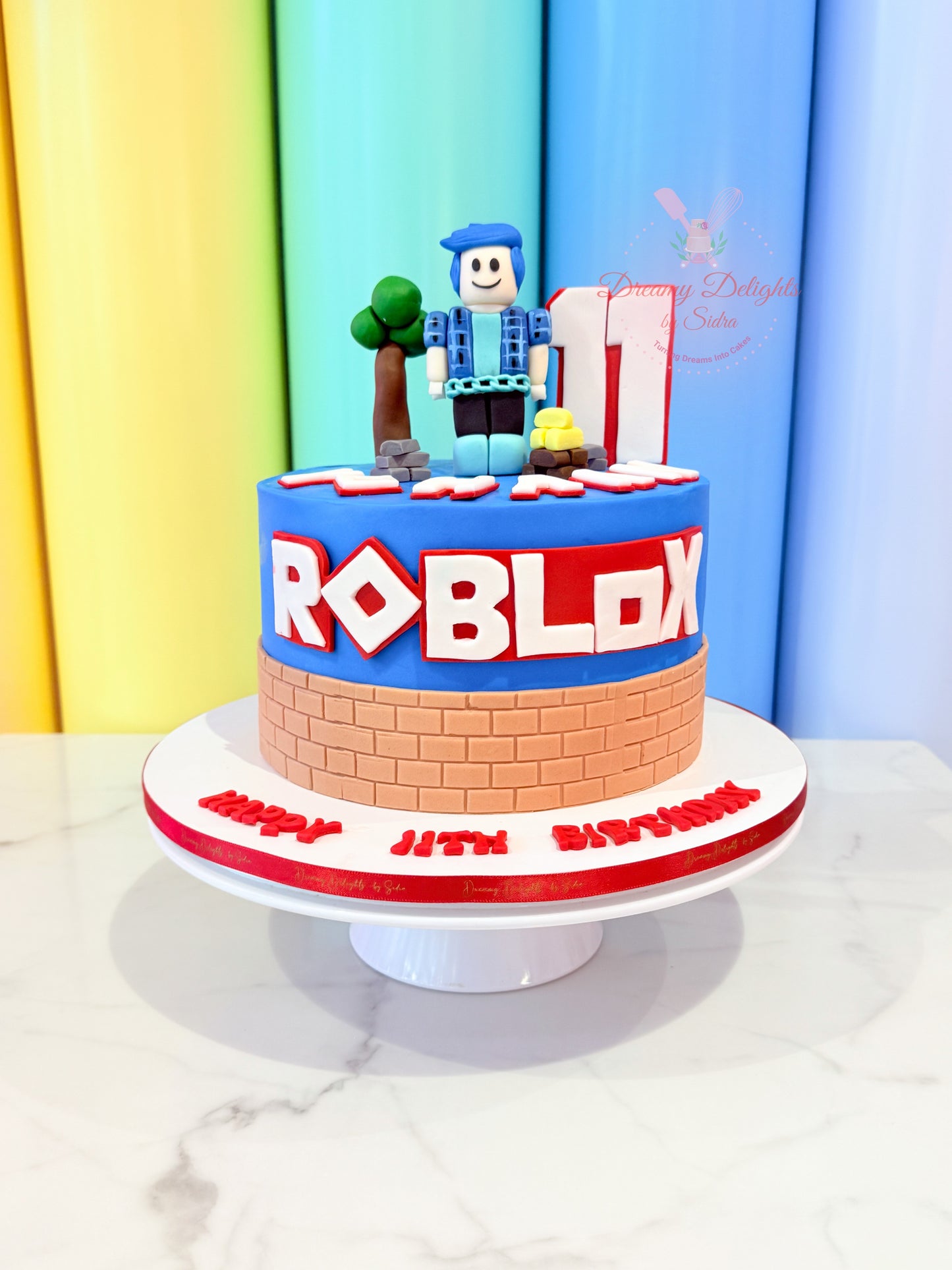 Roblox theme birthday cake with fondant gaming character topper for kids party in Dubai