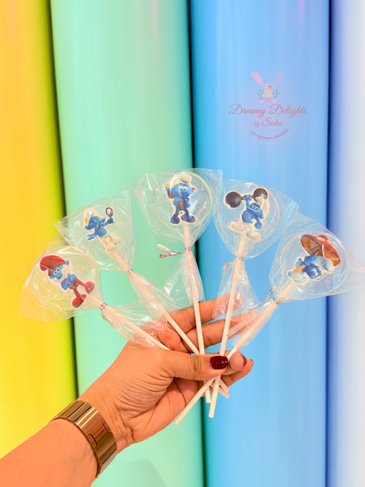 Smurfs themed clear cake pops with cartoon characters for kids party treats in Dubai