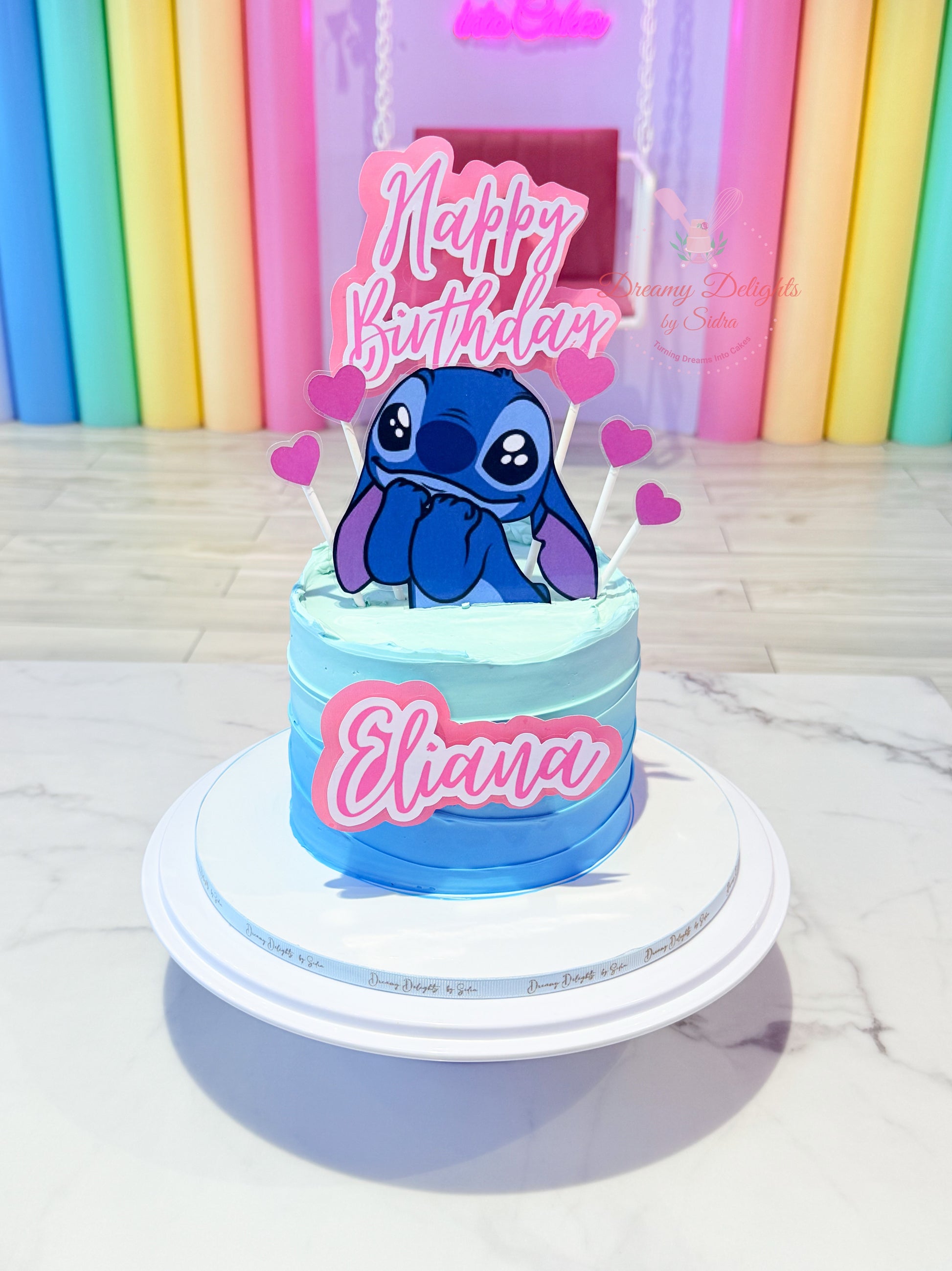 Stitch birthday cake for girls with blue theme and custom name in Dubai