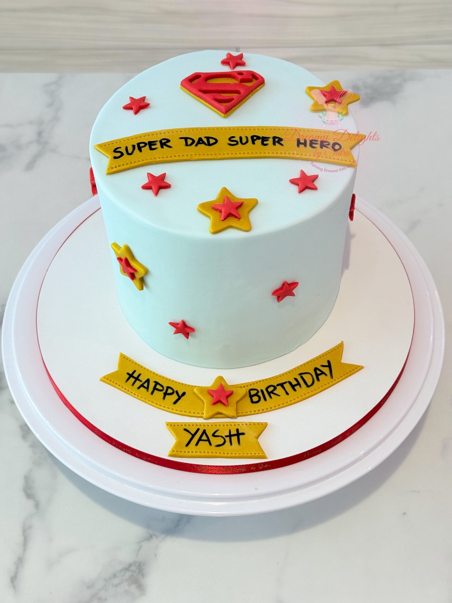 Super Dad super hero cake with fondant stars and buttercream finish