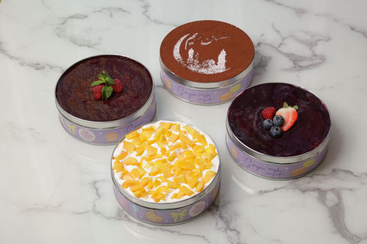 Tiramisu and dream cake tin combo with assorted dessert tins including classic tiramisu and fruity dream cakes Dubai