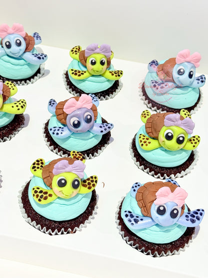Cupcakes decorated with turtle-themed frosting on a white background