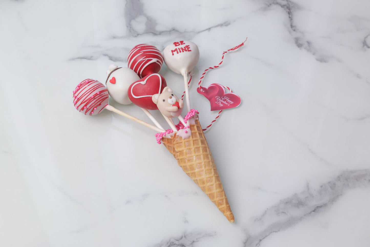 Valentine’s Day love cones with five decorated heart cake pops by Dreamy Delight by Sidra