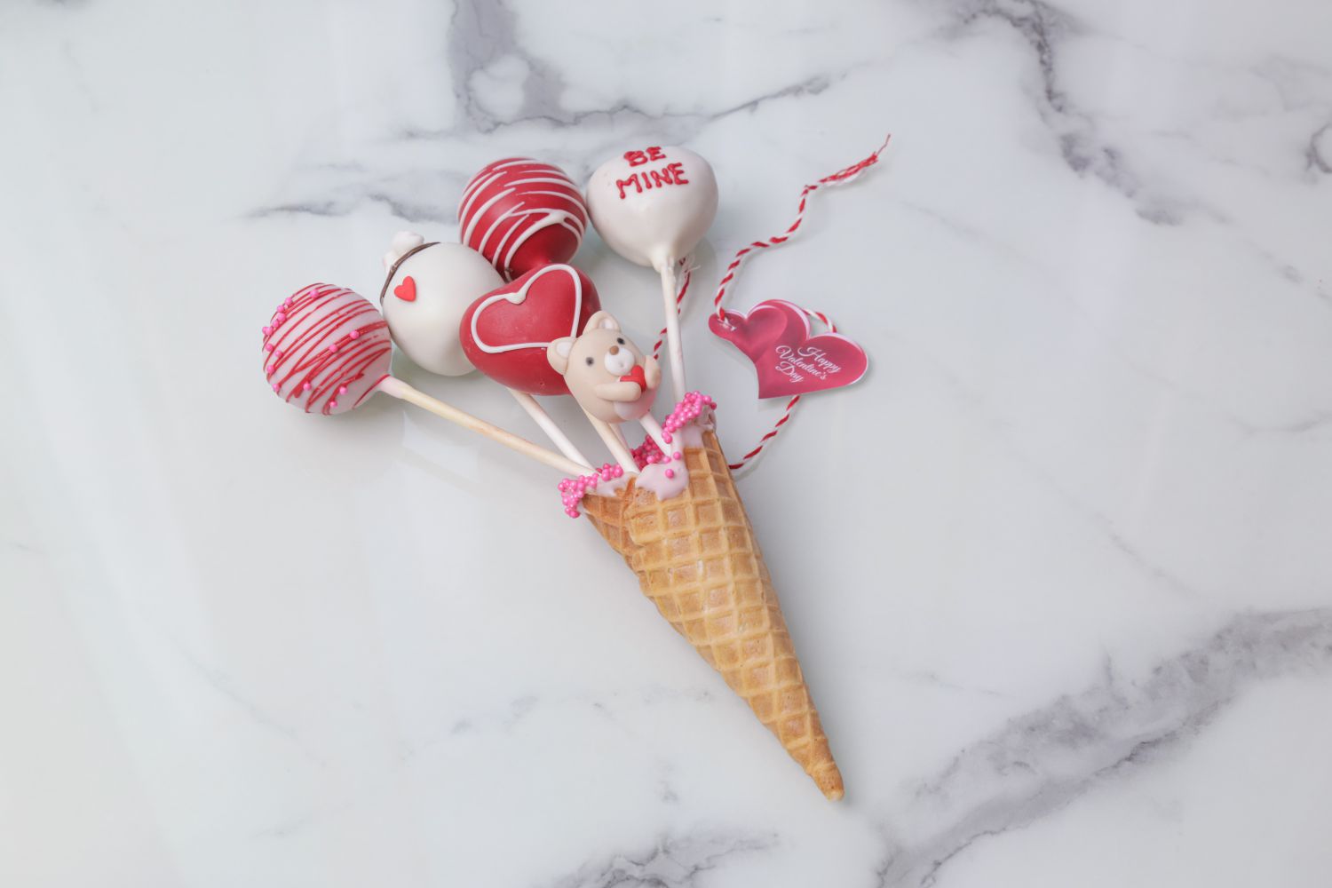 Valentine’s Day love cones with five decorated heart cake pops by Dreamy Delight by Sidra