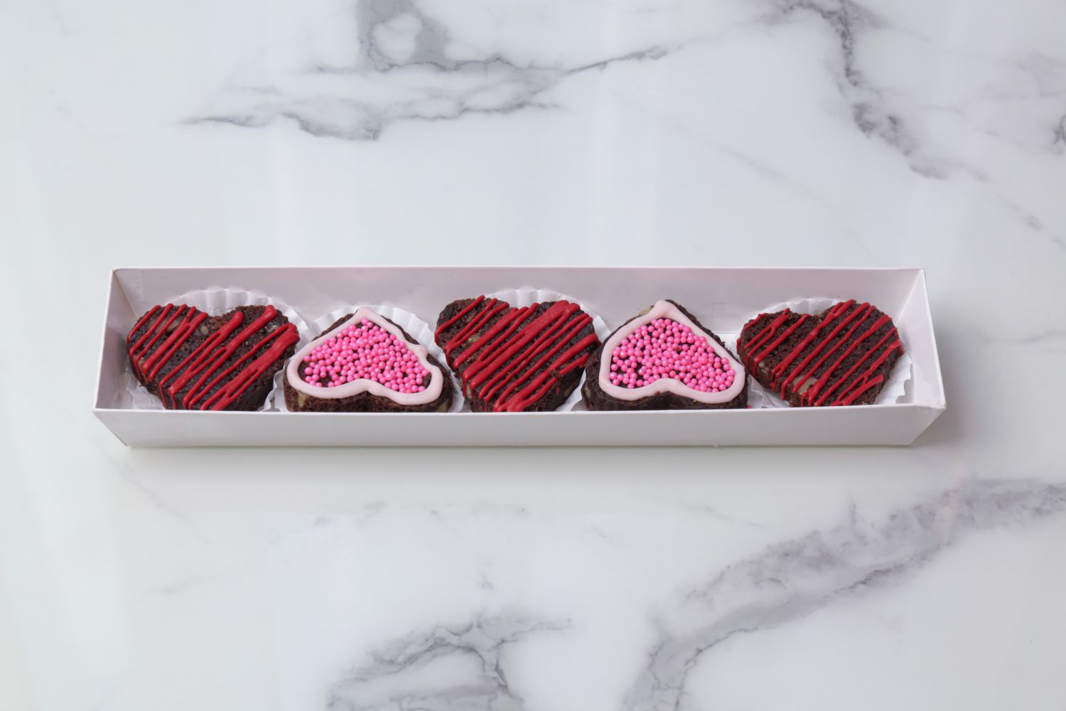 Valentine’s heart-shaped chocolate walnut brownies arranged in a gift box by Dreamy Delight by Sidra