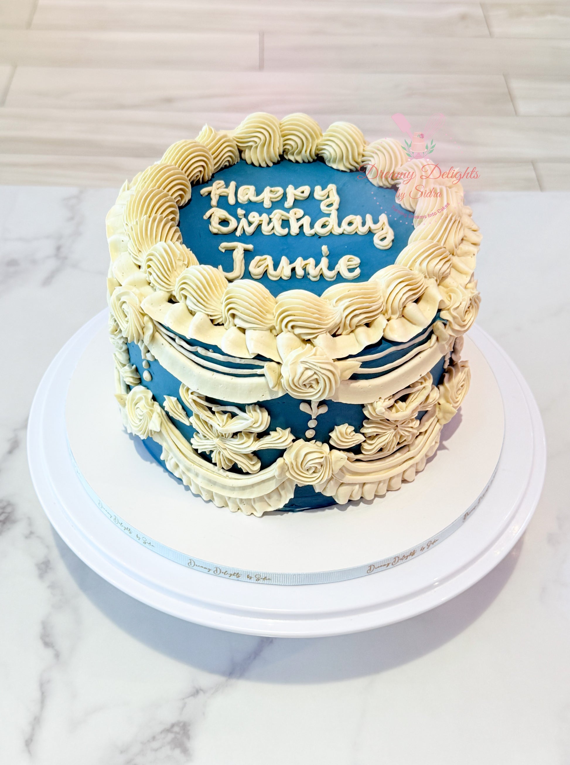 Vintage blue buttercream cake with classic piping design