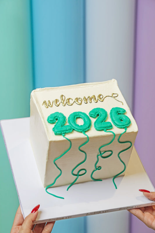 Welcome 2026 New Year balloons cake with buttercream finish by Dreamy Delight by Sidra